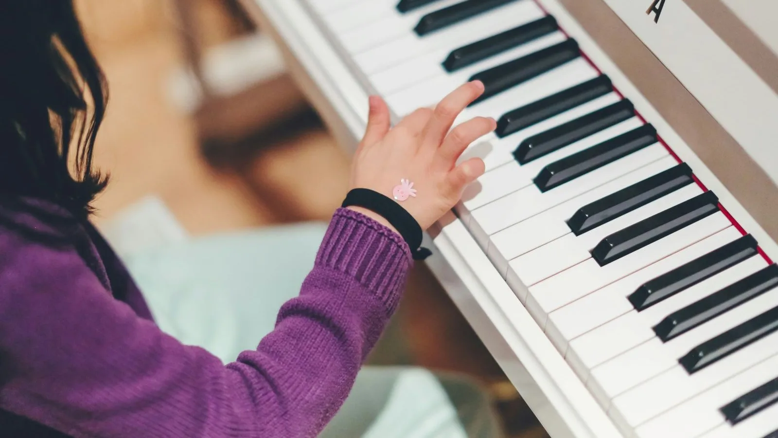 kid playing piano